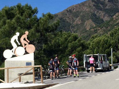 Cyclists resting at viewpoint in Estepona